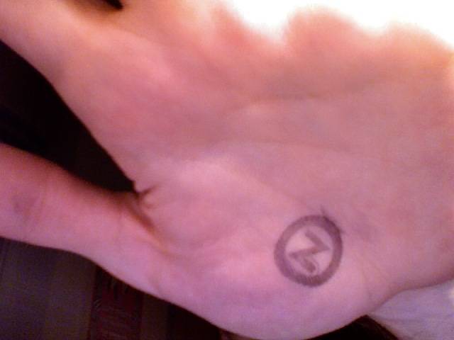 Enterance stamp with a circled Z on my hand