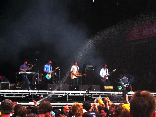dEUS playing at Hurricane 2006 with water being sprayed on the audience