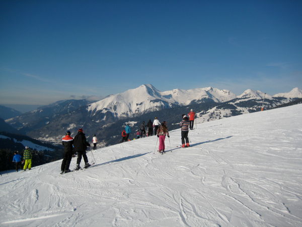 Ski piste with landscape in the background