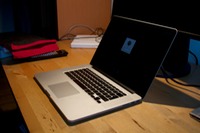 Open MacBook Pro Retina 15 on desk.