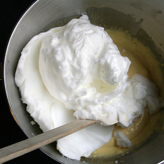 Adding the beaten egg-whites to the egg-yolk crème
